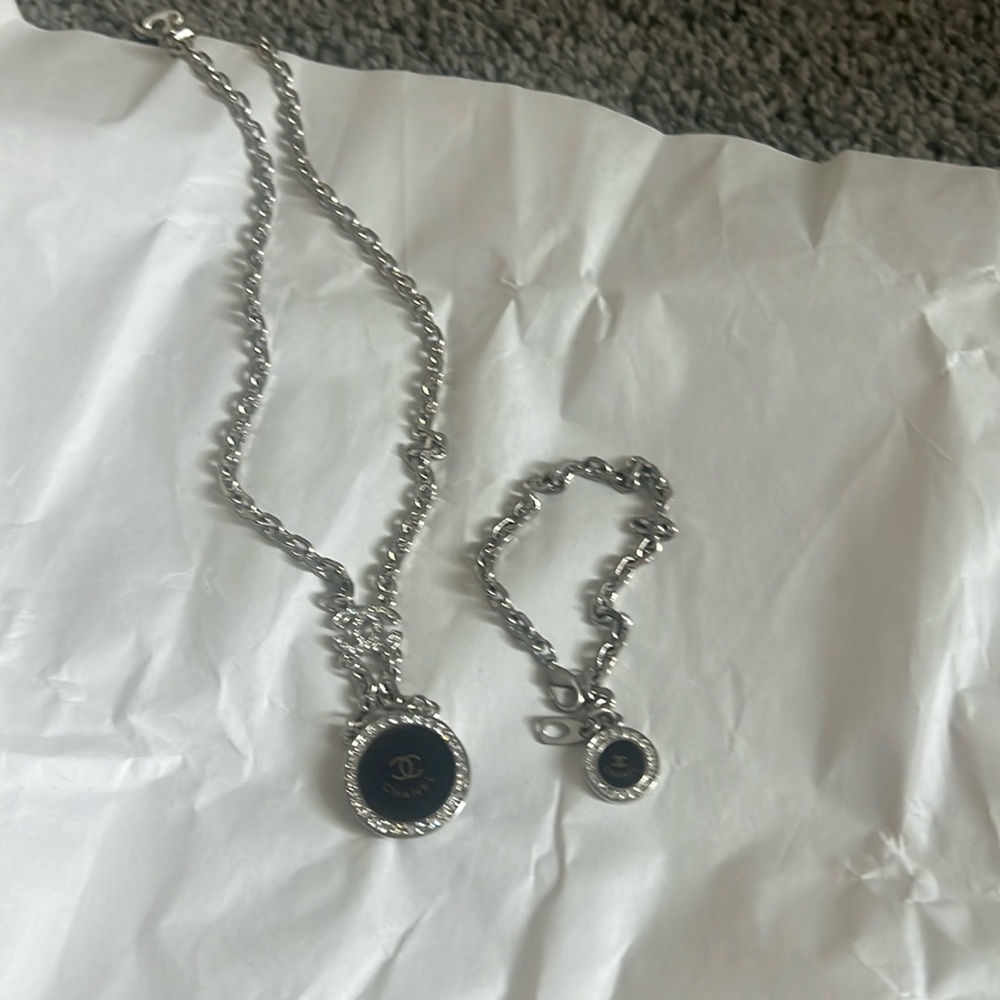 NWOT Silver and Black Pendant Necklace and bracelet.